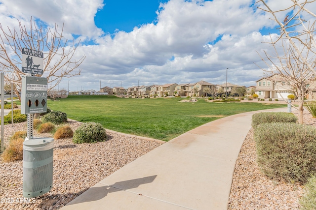 view of property's community with a yard and a residential view