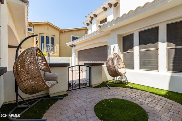 view of patio / terrace featuring a garage