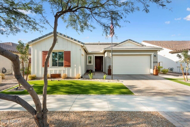 20428 W Elm Dr, Buckeye, AZ 85396 - ranch-style house featuring driveway, a garage, solar panels, board and batten siding, and a front yard
