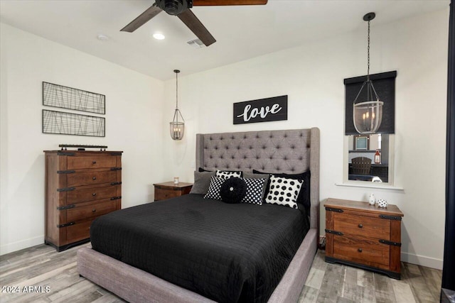 bedroom featuring wood-type flooring and ceiling fan