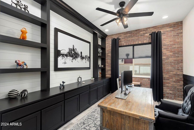 office space featuring ceiling fan, brick wall, and built in features