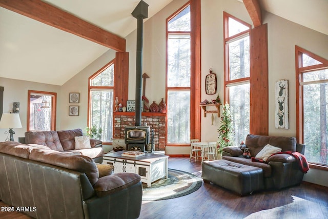 living area with high vaulted ceiling, beam ceiling, wood-type flooring, and a wood stove