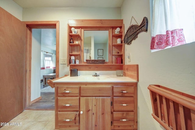 bathroom featuring tile patterned flooring and vanity