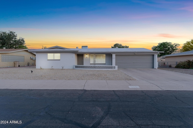 single story home with a garage