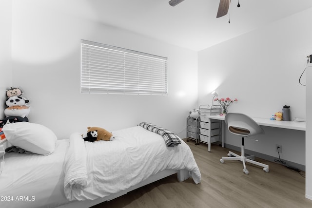 bedroom with ceiling fan and light hardwood / wood-style floors