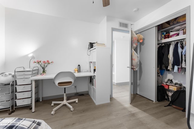 office area with ceiling fan and light hardwood / wood-style floors