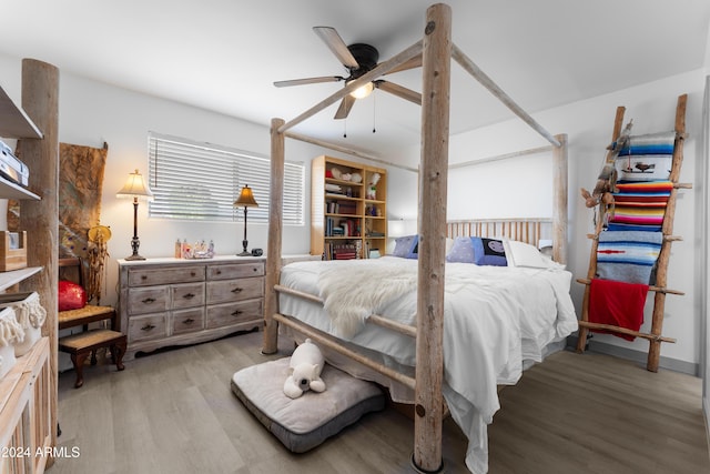 bedroom with ceiling fan and light hardwood / wood-style floors