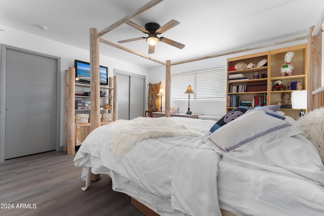 bedroom with ceiling fan, a closet, and wood-type flooring