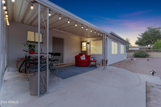 view of patio terrace at dusk