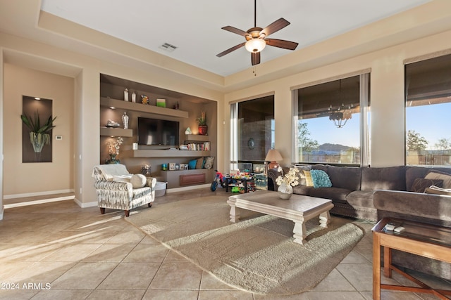 interior space with ceiling fan and tile patterned floors