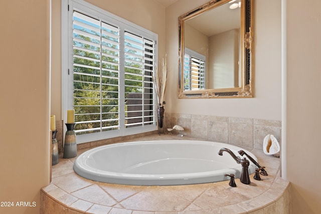 bathroom with tiled tub