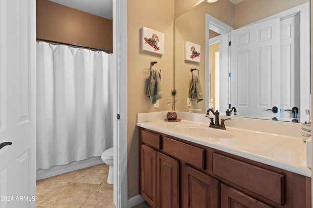 full bathroom featuring toilet, shower / tub combo, vanity, and tile patterned floors