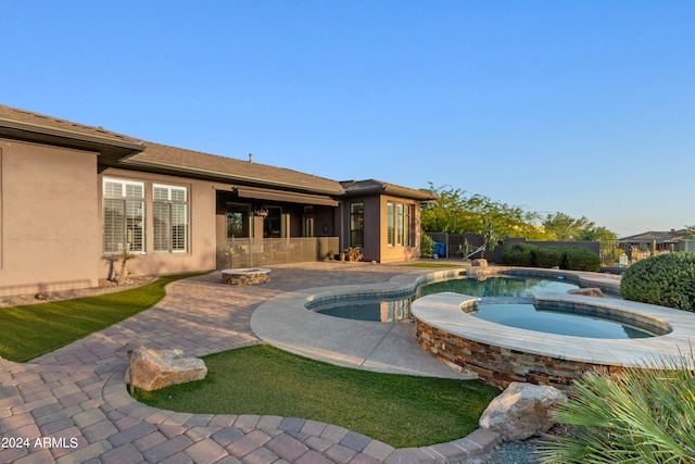 view of swimming pool with a patio and an in ground hot tub