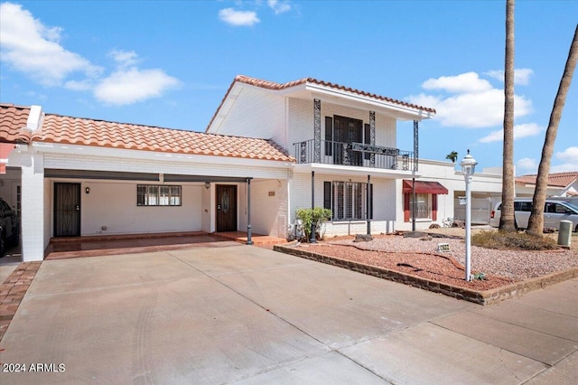 mediterranean / spanish home featuring a balcony