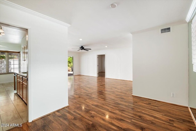 spare room featuring ornamental molding, ceiling fan, and dark hardwood / wood-style floors