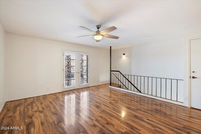 spare room with ceiling fan and dark hardwood / wood-style flooring