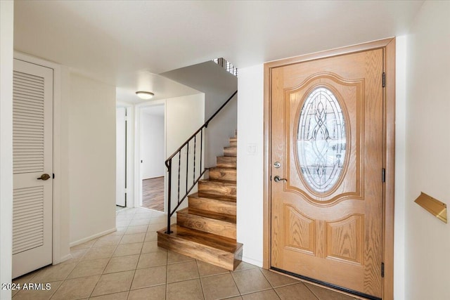 entrance foyer with light tile patterned floors