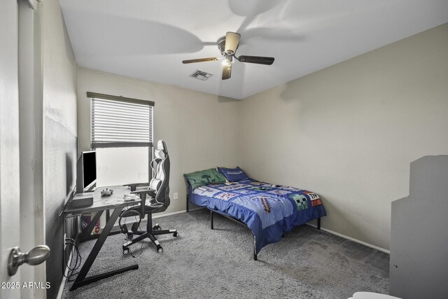 carpeted bedroom with visible vents, ceiling fan, and baseboards