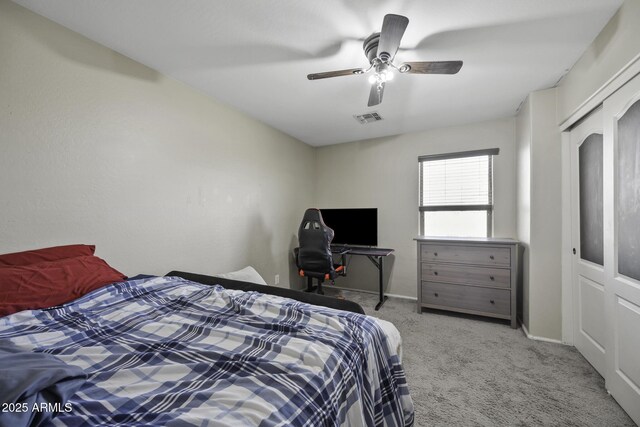 bedroom with visible vents, baseboards, ceiling fan, and carpet flooring