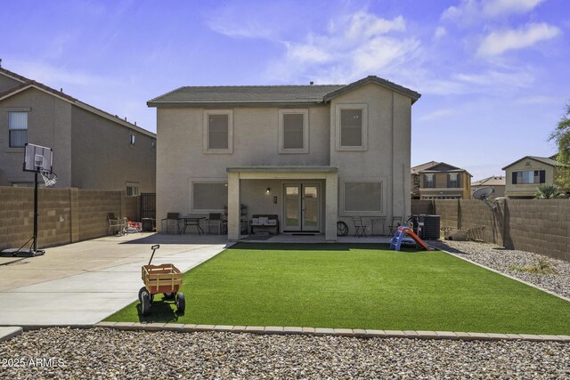 back of house featuring a patio area, central AC unit, stucco siding, and a fenced backyard