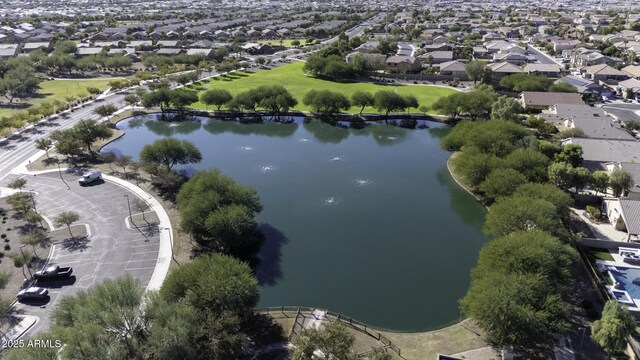 drone / aerial view with a residential view and a water view