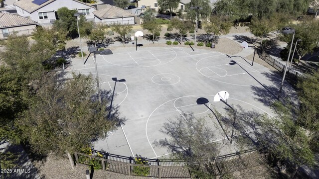 view of sport court with a residential view, community basketball court, and fence