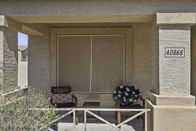 doorway to property with stucco siding
