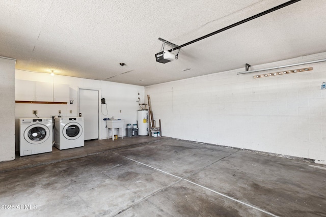 garage with sink, a garage door opener, gas water heater, and independent washer and dryer