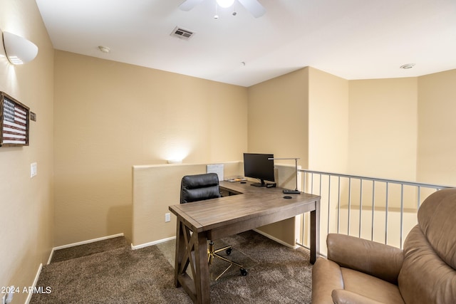 office space featuring visible vents, baseboards, ceiling fan, and carpet floors
