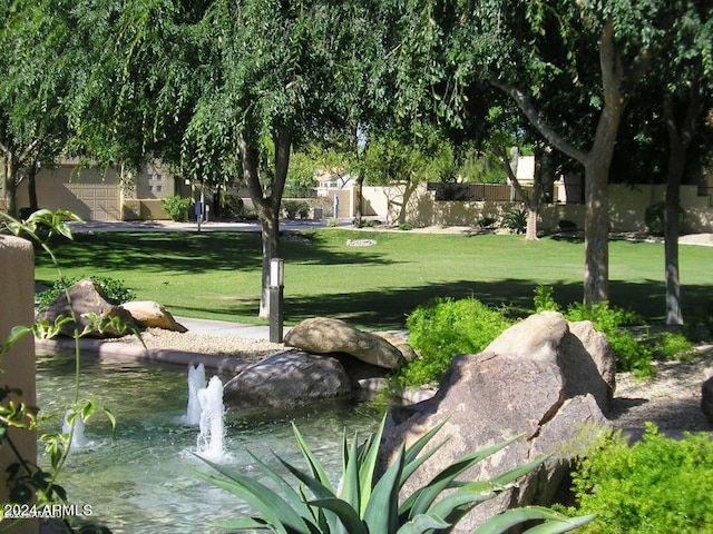 view of community featuring a yard