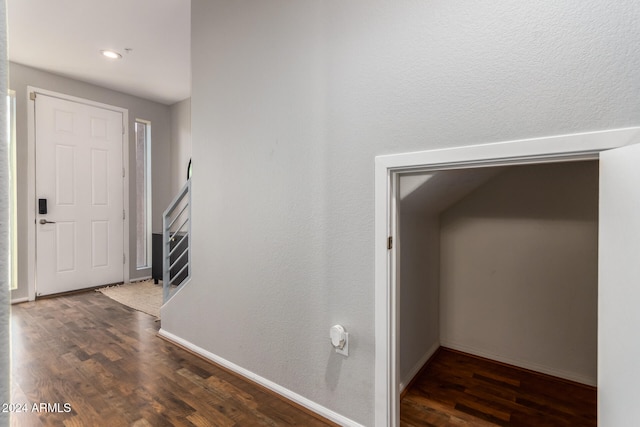 hall with dark hardwood / wood-style flooring