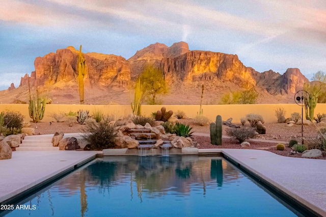 view of pool with a mountain view