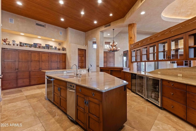 kitchen featuring wine cooler, visible vents, brown cabinetry, wood ceiling, and a sink