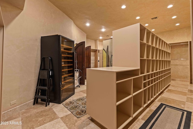 wine cellar featuring visible vents and recessed lighting