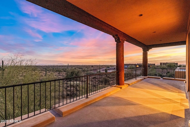 view of balcony at dusk