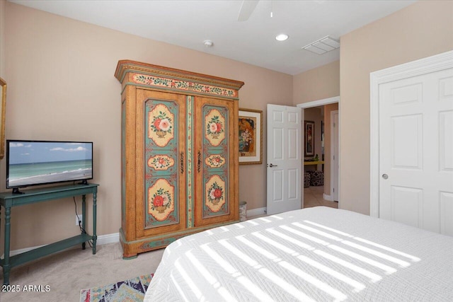 bedroom with light carpet and ceiling fan