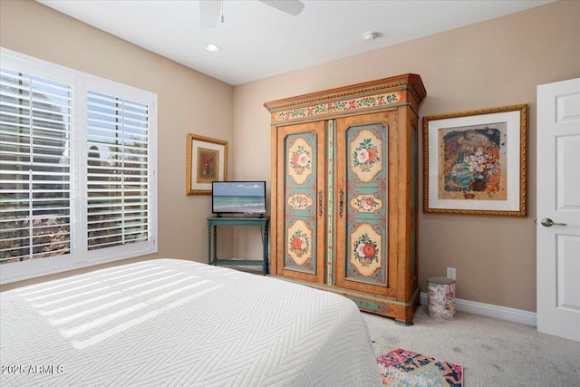 carpeted bedroom featuring ceiling fan