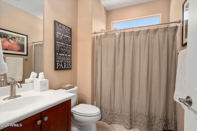 bathroom featuring vanity, toilet, and a shower with shower curtain