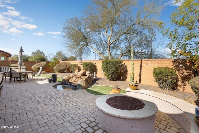 view of patio featuring a fire pit