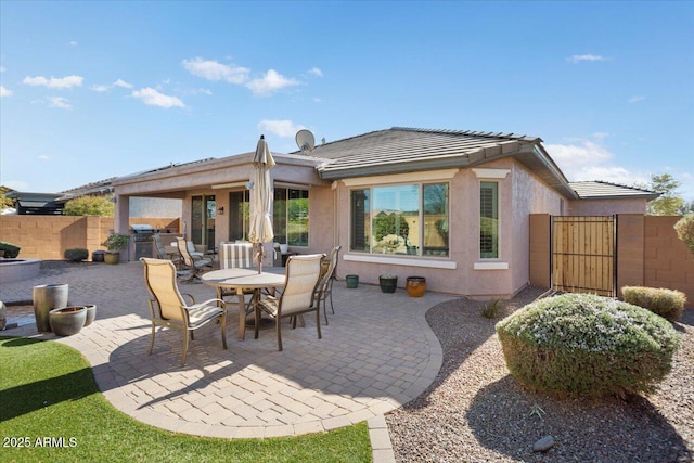 rear view of house with a patio area