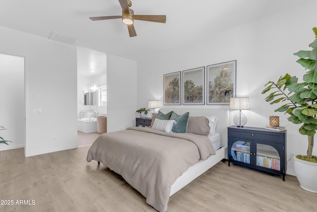 22634 E Roundup Way, Queen Creek, AZ 85142 - bedroom featuring light wood-style floors, ensuite bathroom, and ceiling fan
