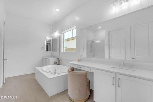 22634 E Roundup Way, Queen Creek, AZ 85142 - full bathroom featuring a garden tub, a shower stall, two vanities, and recessed lighting