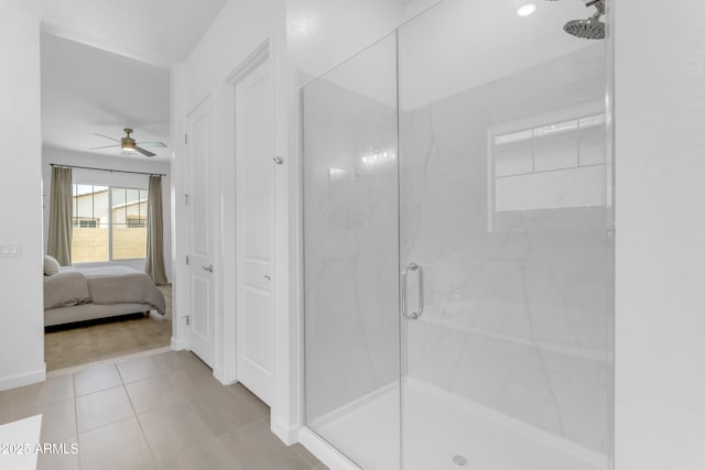 22634 E Roundup Way, Queen Creek, AZ 85142 - bathroom with a marble finish shower, a ceiling fan, connected bathroom, and tile patterned flooring
