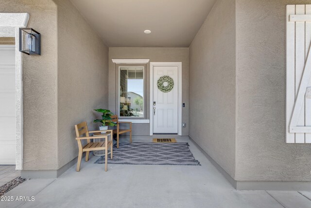 22634 E Roundup Way, Queen Creek, AZ 85142 - doorway to property featuring stucco siding and a porch
