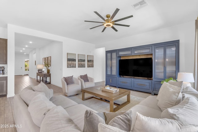 22634 E Roundup Way, Queen Creek, AZ 85142 - living room with a ceiling fan and light wood-type flooring