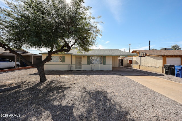 view of front facade with a carport