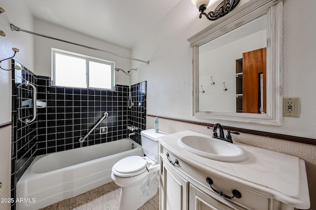 full bathroom with vanity, toilet, and tiled shower / bath combo