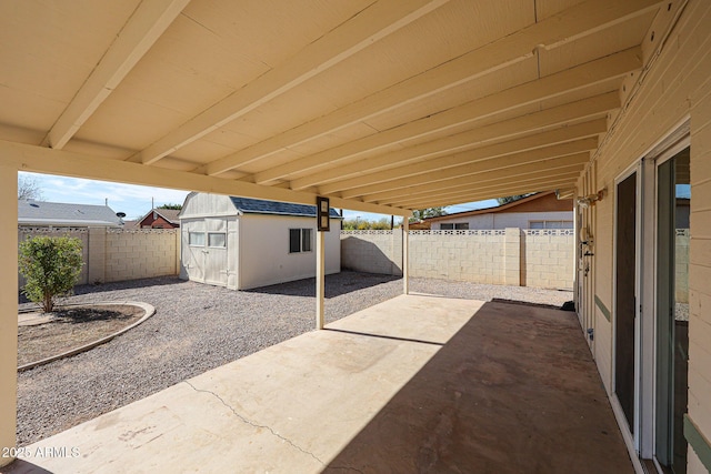 view of patio / terrace with a shed