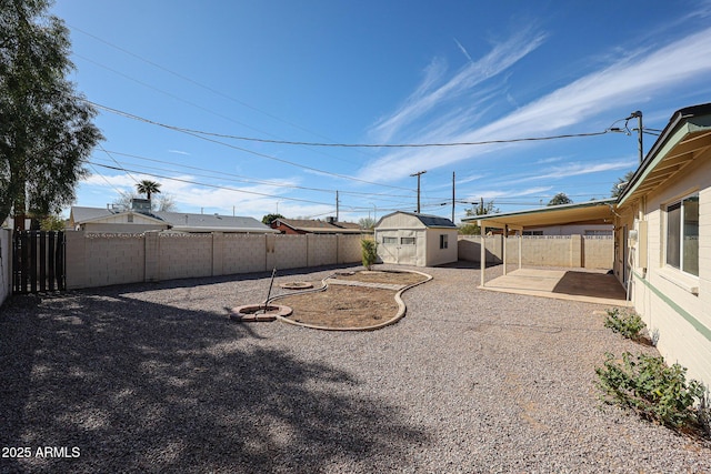 view of yard with a patio and a shed