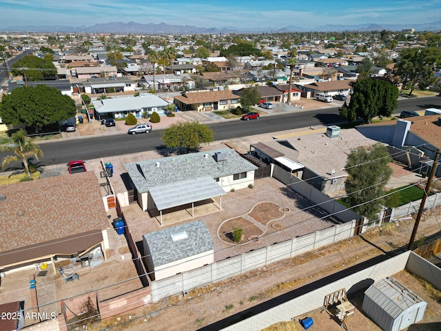 birds eye view of property with a mountain view